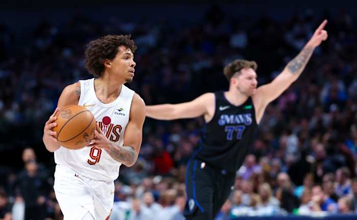 Dec 27, 2023; Dallas, Texas, USA; Cleveland Cavaliers guard Craig Porter (9) looks to score as Dallas Mavericks guard Luka Doncic (77) reacts during the first quarter at American Airlines Center.